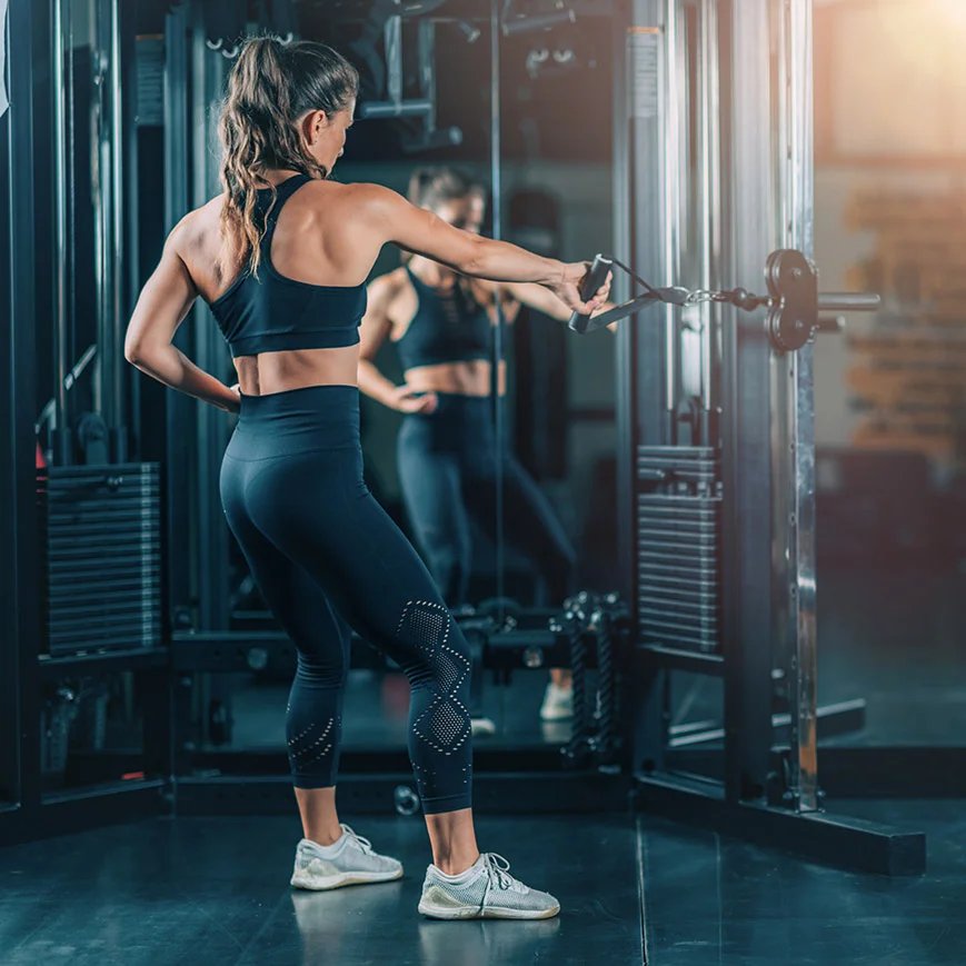 woman-doing-exercise-on-a-machine-in-a-gym